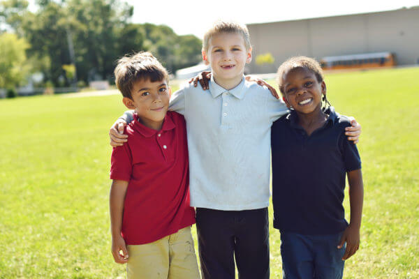 Students at Battle Creek Montessori Academy posing in the yard outside of school!
