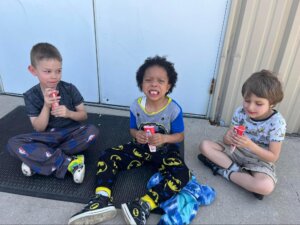 BCMA Students enjoying the weather in the school courtyard for popsicles.